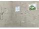 Modern bathroom featuring a luxurious walk-in shower with marble at 9048 Luna Ln, Sarasota, FL 34241
