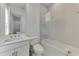 Modern bathroom includes a vanity sink and a tiled shower/tub combination at 9048 Luna Ln, Sarasota, FL 34241