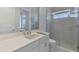 Clean bright bathroom featuring a white vanity, shower, and tile at 9048 Luna Ln, Sarasota, FL 34241