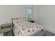 Bedroom with a sea shell themed comforter set with an accent pillow set, matching decor, and neutral colors at 9048 Luna Ln, Sarasota, FL 34241