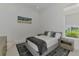 Comfortable bedroom features neutral paint, plush rug and ample sunlight at 9048 Luna Ln, Sarasota, FL 34241