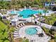 Amazing community pool area featuring a splash pad, hot tub, and plenty of lounge chairs for residents at 9048 Luna Ln, Sarasota, FL 34241