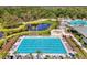Enjoy the luxurious community pool, complete with sun loungers and lush landscaping at 9048 Luna Ln, Sarasota, FL 34241