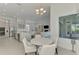Bright breakfast nook with backyard view adjacent to kitchen featuring stainless appliances and island with seating at 9048 Luna Ln, Sarasota, FL 34241