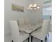 Bright dining room featuring a quartz-topped table and stylish chandelier at 9048 Luna Ln, Sarasota, FL 34241