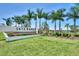 Landscaped entrance to Skye Ranch Sarasota with vibrant flowers and elegant signage at 9048 Luna Ln, Sarasota, FL 34241