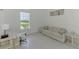 A bright home office area featuring a sleek desk and comfortable seating area at 9048 Luna Ln, Sarasota, FL 34241