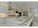 Gourmet kitchen with a large island, stainless steel appliances, and custom cabinetry at 9048 Luna Ln, Sarasota, FL 34241