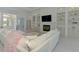 Bright living room featuring a fireplace, built-in shelving, and lots of natural light and stylish decor at 9048 Luna Ln, Sarasota, FL 34241