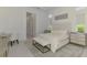Well-lit main bedroom featuring a bench and a sleek desk at 9048 Luna Ln, Sarasota, FL 34241