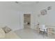 A home office features a desk, chair, and open doorway that leads into an open living area at 9048 Luna Ln, Sarasota, FL 34241