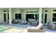 A beautiful outdoor living space featuring a pool, spa, and comfortable seating area with seamless indoor-outdoor flow at 9048 Luna Ln, Sarasota, FL 34241
