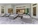 Open concept patio with plenty of seating and relaxing views of backyard and pool at 9048 Luna Ln, Sarasota, FL 34241