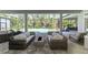 Spacious screened patio with lounge furniture, an outdoor kitchen, and a swimming pool at 9048 Luna Ln, Sarasota, FL 34241