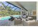Resort-style pool and patio area with lounge chairs and inviting backyard views at 9048 Luna Ln, Sarasota, FL 34241
