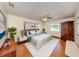 Comfortable main bedroom features a ceiling fan, a large window and stylish decor at 976 Euclid Rd, Venice, FL 34293
