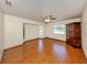 Spacious bedroom features hardwood flooring, ample natural light, and a ceiling fan at 976 Euclid Rd, Venice, FL 34293