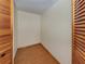 Walk-in closet features hardwood floor and plenty of storage space at 976 Euclid Rd, Venice, FL 34293