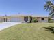 Charming one-story home with a well-maintained lawn and two-car garage at 976 Euclid Rd, Venice, FL 34293