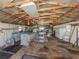 Spacious garage features high ceilings with wooden rafters at 976 Euclid Rd, Venice, FL 34293