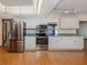 Modern kitchen featuring stainless steel appliances, and ample cabinet space at 976 Euclid Rd, Venice, FL 34293