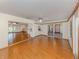 Bright living room featuring wood floors, a ceiling fan, and an open floor plan at 976 Euclid Rd, Venice, FL 34293
