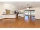 Bright open living area with hardwood floors seamlessly connecting to the kitchen at 976 Euclid Rd, Venice, FL 34293