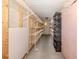 Ample storage room in the basement with shelving for organization at 976 Euclid Rd, Venice, FL 34293