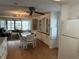 Bright dining room with a chandelier, dining table set, and views of the lanai at 103 Lakeview Dr, North Port, FL 34287