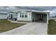 Cozy single-story home with a carport and well-manicured landscaping at 103 Lakeview Dr, North Port, FL 34287