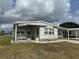 Charming single-story home featuring a covered entrance and a well-maintained front yard at 103 Lakeview Dr, North Port, FL 34287