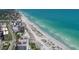 Stunning aerial view of a coastal community with beachfront properties and turquoise waters at 1032 Elaine St, Venice, FL 34285