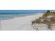 Expansive beachfront with white sand and turquoise water, perfect for relaxation and recreation at 1032 Elaine St, Venice, FL 34285