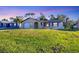 Charming single-Gathering home with a well-maintained lawn and attached one car garage at 1032 Elaine St, Venice, FL 34285
