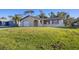 Charming single-Gathering home with a well-maintained lawn and attached one car garage at 1032 Elaine St, Venice, FL 34285