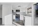 Beautifully renovated kitchen with stainless steel appliances, modern cabinetry, and marble backsplash at 1032 Elaine St, Venice, FL 34285