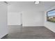 Spacious and well-lit living area with sleek modern flooring and neutral paint creating an airy feel at 1032 Elaine St, Venice, FL 34285