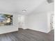 Open-concept living room with modern flooring, neutral decor, and view of the surrounding neighborhood at 1032 Elaine St, Venice, FL 34285
