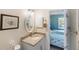 Bathroom vanity with granite countertop, modern fixtures, and access to the bedroom at 10444 Willmington Blvd, Englewood, FL 34224