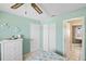 Well-lit bedroom with closet space, neutral walls, and tile flooring at 10444 Willmington Blvd, Englewood, FL 34224