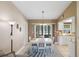 Inviting dining area with slider doors to the lanai, adjacent to the kitchen at 10444 Willmington Blvd, Englewood, FL 34224