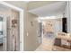 Hallway area leading into the kitchen and dining area with tile floors at 10444 Willmington Blvd, Englewood, FL 34224