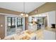 Bright kitchen open to the dining area, features stainless steel appliances and granite counters at 10444 Willmington Blvd, Englewood, FL 34224