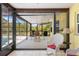 Lanai overlooking the backyard patio with grill and patio furniture at 10444 Willmington Blvd, Englewood, FL 34224