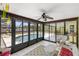 Screened-in lanai overlooking the pool and backyard at 10444 Willmington Blvd, Englewood, FL 34224