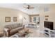 Open-concept living area seamlessly blends relaxation and dining in a bright space at 10444 Willmington Blvd, Englewood, FL 34224