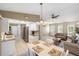 Open-concept living space combining kitchen, dining, and living room in a seamless design at 10444 Willmington Blvd, Englewood, FL 34224