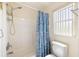 Shower stall with mounted shower head and handheld shower unit next to toilet at 10444 Willmington Blvd, Englewood, FL 34224