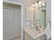 Bathroom featuring a single sink vanity with storage and a medicine cabinet at 1104 Auburn Cove Cir, Venice, FL 34292