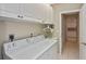 Convenient laundry room with washer, sink, and ample storage in white cabinets at 1104 Auburn Cove Cir, Venice, FL 34292
